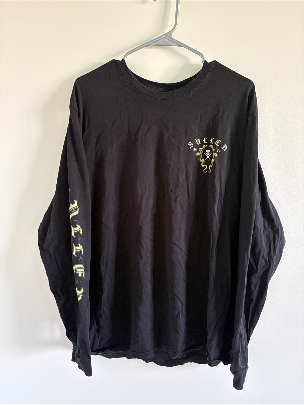 Black Long-Sleeve Graphic Tee with Yellow Accent